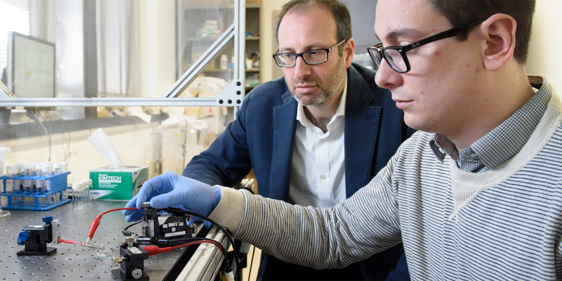 
A 2017 photo of Alberto Salleo, left, and graduate student Scott Keene with a previous artificial synapse design. | Photo by L.A. Cicero