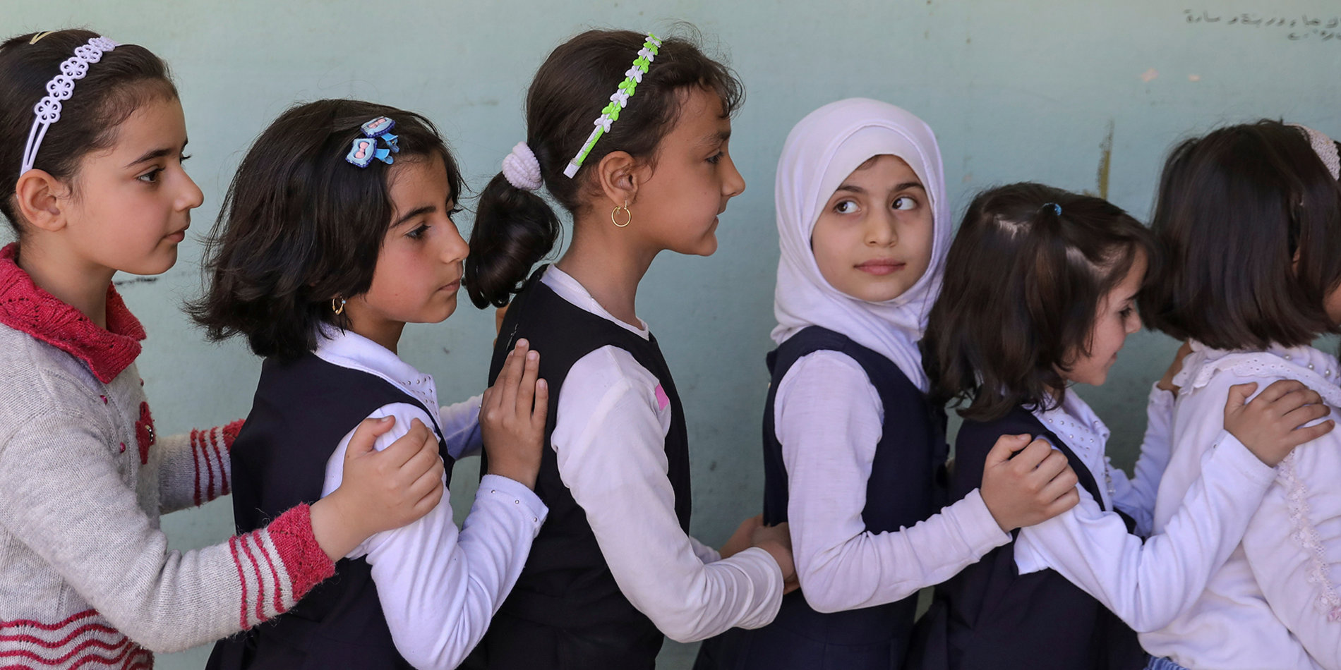 
Students walk out of their classroom at an elementary school in eastern Mosul. | Reuters/Marko Djurica