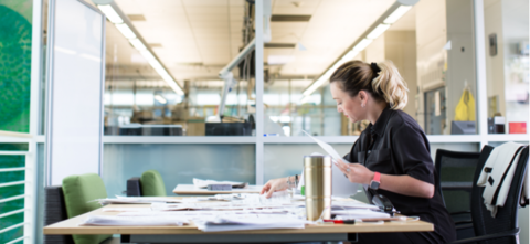 Woman at desk with paperwork