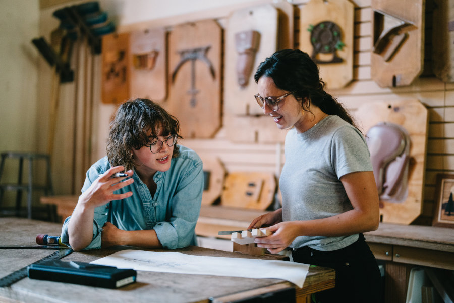 Two maker students talking